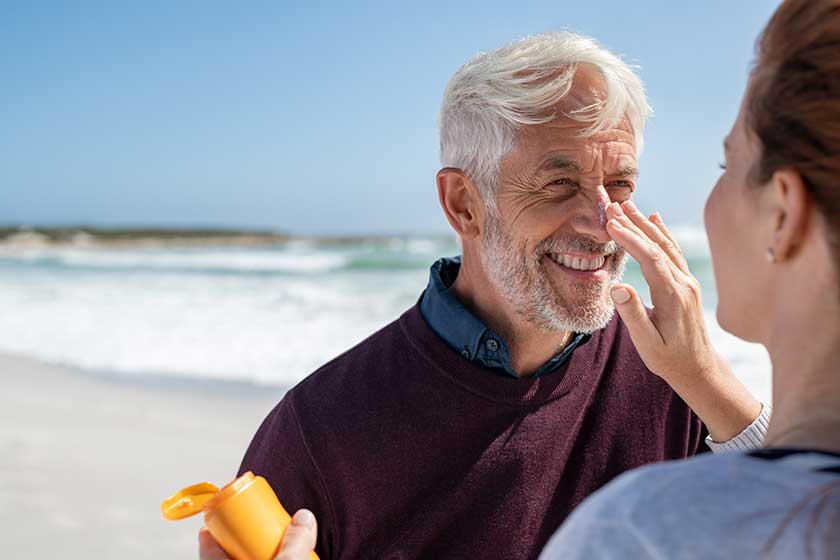 Portrait of cheerful old man looking at his mature wife Portrait of cheerful old man looking at his mature wife