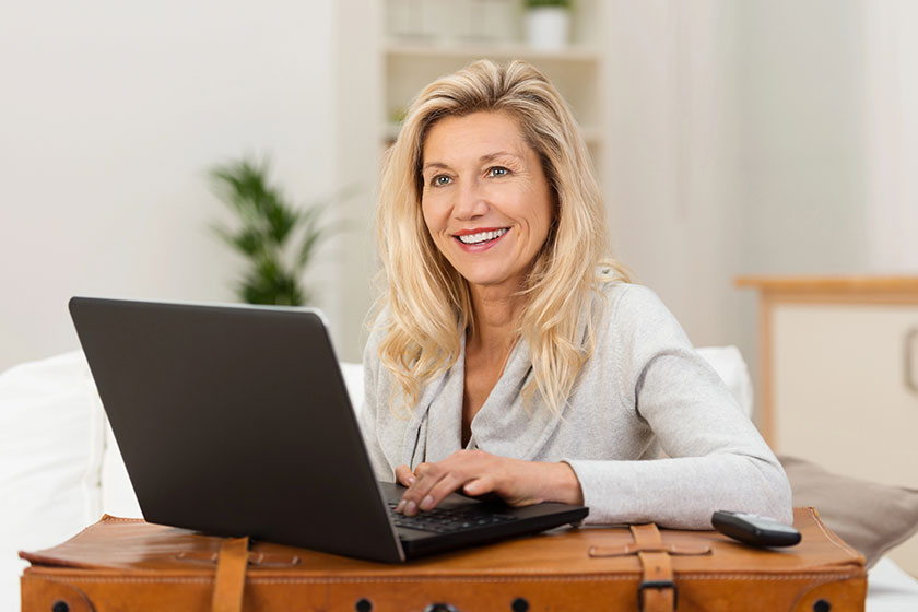 Woman communicating home on laptop Woman communicating home on laptop