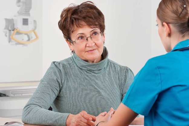 Doctor-and-patient-discussing Doctor-and-patient-discussing