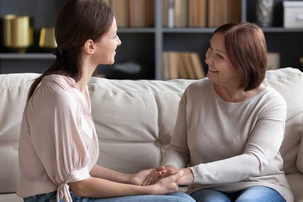 Happy-young-woman-communicating-with-affectionate.