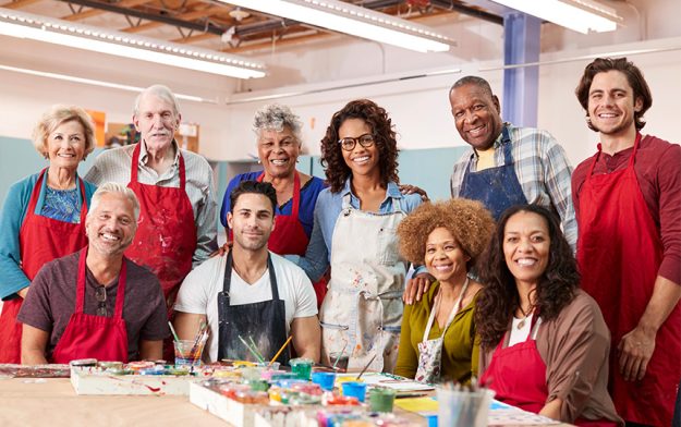 Portrait-mature-adults-attending-art-class-community-centre-teache