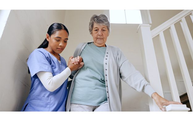 Senior-woman-nurse-help-stairs-retirement-home-caregiver-support