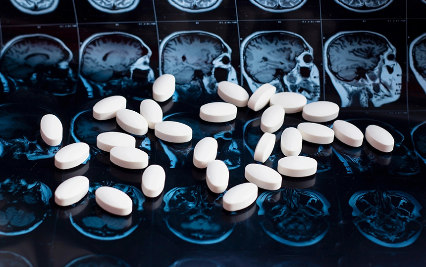 White-pharmaceutical-medicine-pills-magnetic-brain-resonance-scan-mri-background