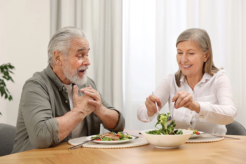 happy-senior-couple-having-dinner Happy senior couple having dinner at home
