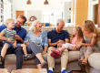 Multi-Generation Family Sitting On Sofa